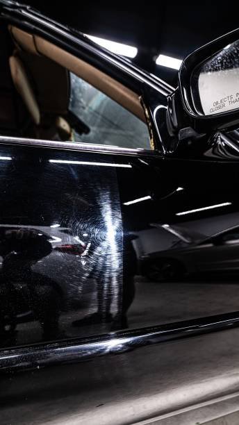 Before and after effect after paint polishing, varnish correction in car detailing studio or car wash. Shiny and scratched car paint.